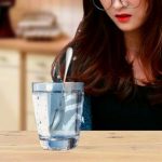 Girl-looking-at-glass-of-water.jpg
